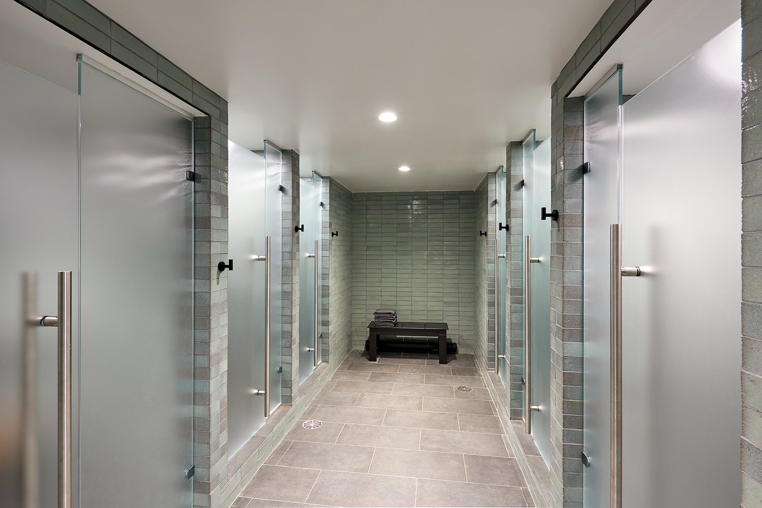 Luxury gym shower cubicles at the Nomad Tower hotel