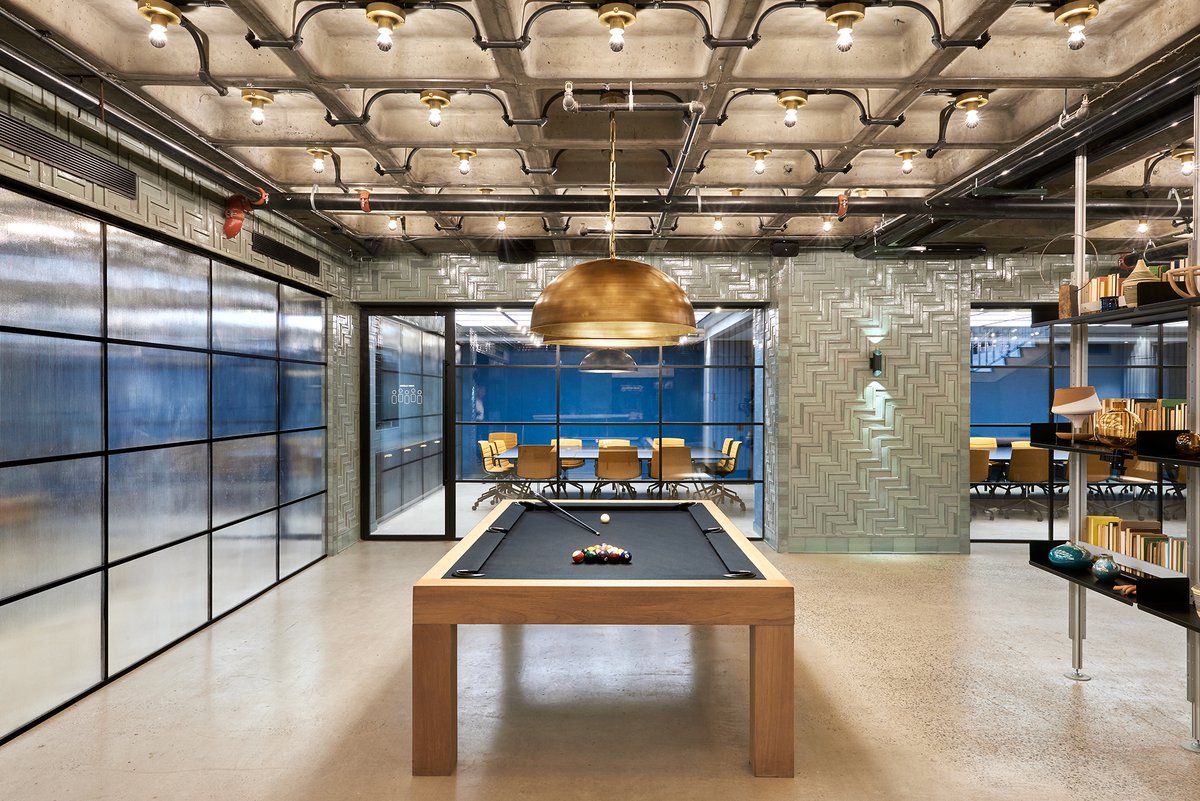 Nomad Tower's conference room and a lounge with pool table